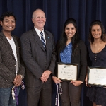Doctor Potteiger posing for a photo with three award recipients